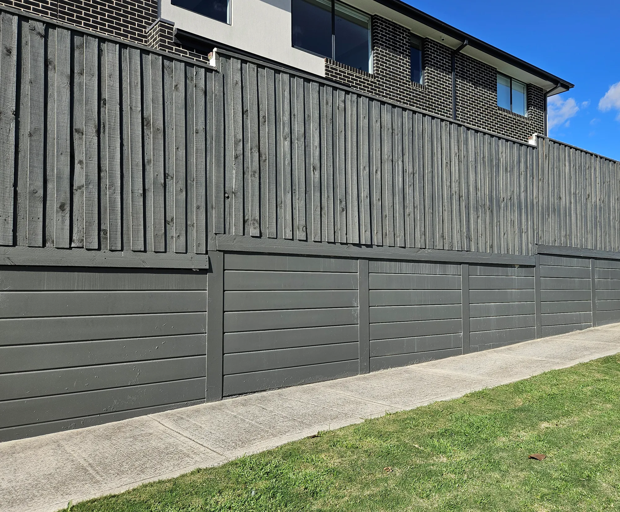 Plain Marina Smooth Concrete Sleepers Used for Under Fence Plinth and Painted in Grey and Supplied by Sunset Sleepers