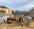 Large Boundry Retaining Wall Being Constructed using The Marina Smooth Concrete Sleepers in Plain Grey - Constructed by the team at JBS Retaining Walls & Excavations and Supplied by Sunset Sleepers